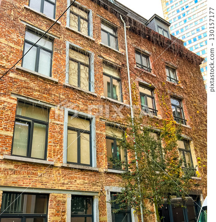 Exterior view of a charming brick building in brussels with modern touches Exterior view of a charming brick building in brussels with modern touches 130157177