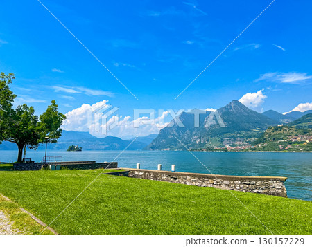 Carzano public beach on Monte Isola in Lake Iseo, Lombardy, Italy. 130157229