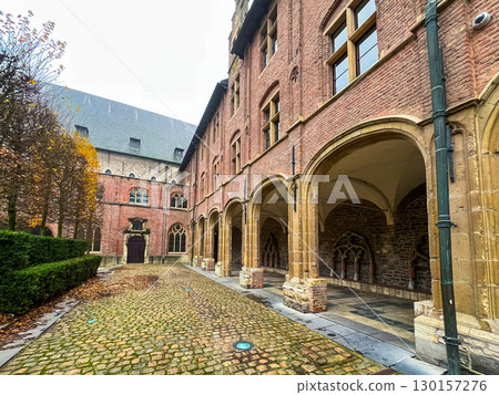 Beautiful arches and columns in historic courtyard of ghent university, belgium 130157276