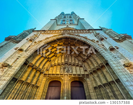 The glorious front door of Ghent cathedral highlighted in golden light The glorious front door of Ghent cathedral highlighted in golden light 130157388