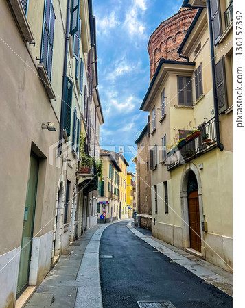 Traditional buildings with balconies, shutter windows and colored walls, Brescia 130157392