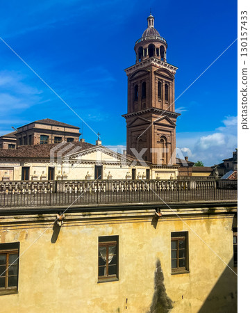 Bell tower of the santa barbara church surrounded by magnificent Mantua skies Bell tower of the santa barbara church surrounded by magnificent Mantua skies 130157433