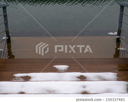 Snowy wooden Steps Leading to lake Snowy wooden Steps Leading to lake 130157481