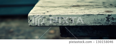 Weathered wooden table surface with rustic charm in an outdoor setting during late afternoon 130158046