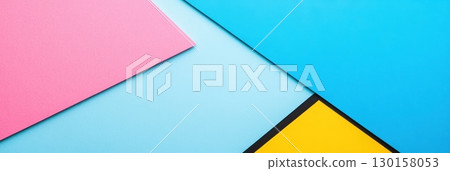 Colorful arrangement of paper sheets on a flat surface creating a vibrant artistic backdrop 130158053