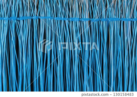 Vibrant blue synthetic threads woven tightly together create a striking visual pattern Vibrant blue synthetic threads woven tightly together create a striking visual pattern 130158483