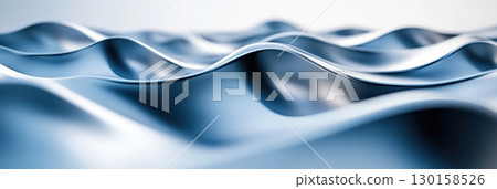 Waves of blue fabric gently undulating in soft light creating a serene visual atmosphere 130158526