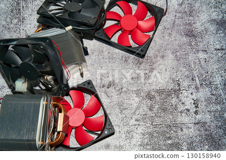 From above of vintage red CPU cooler also called PC cooling fan placed on surface From above of vintage red CPU cooler also called PC cooling fan placed on surface 130158940