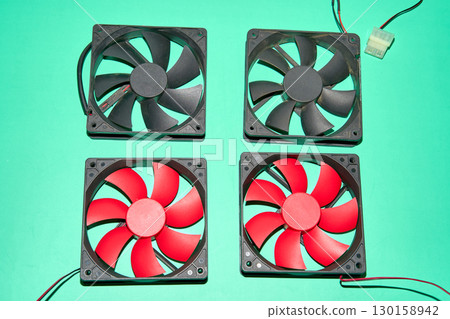 From above of vintage red CPU cooler also called PC cooling fan placed on surface From above of vintage red CPU cooler also called PC cooling fan placed on surface 130158942