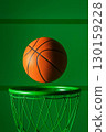 Basketball ball flying over green hoop on vibrant background. Minimalist sports concept, dynamic composition, athletic 130159228