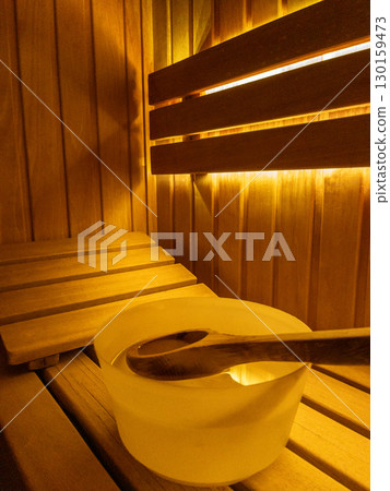 Relaxing Wooden Sauna Interior, Wooden sauna interior with pebbles in a wooden box 130159473