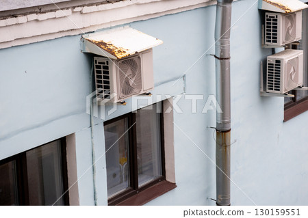 air conditioners are installed on the wall of the building. cooling in hot weather. 130159551