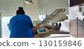 Dental care for children in a modern clinic: a dentist treats a young patient in a chair with a lamp and instruments. Concept: healthcare, prevention, hygiene 130159846