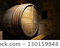 A historic wine cellar with an antique wooden press, grape crusher, and giant barrel. The concept is traditional winemaking heritage and craftsmanship. 130159848