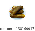 A plate of salted and crispy cucumbers and a sprig of dill 130160017