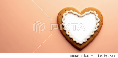 Heart-shaped cookie with white icing 130160783