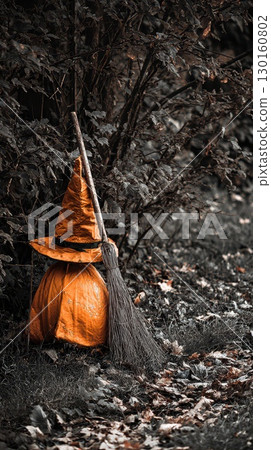 Halloween decoration with witch hat and broomstick 130160802