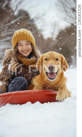 Girl and Golden Retriever Enjoying Sledding 130161326