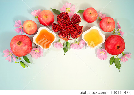 Autumn banner with honey, apples, pomegranates, flowers, dried fruits for holiday greetings, composition for Jewish holiday Rosh Hashanah with traditional symbols, creative layout for design, template Autumn banner with honey, apples, pomegranates, flowers, dried fruits for holiday greetings, composition for Jewish holiday Rosh Hashanah with traditional symbols, creative layout for design, template 130161424