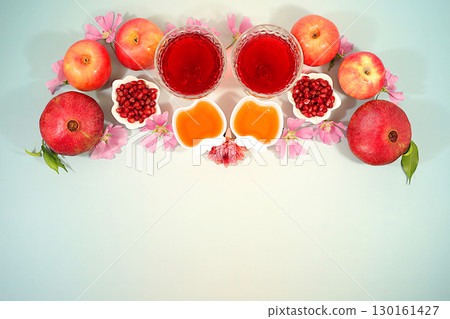 Advertising banner with symbols of the Jewish New Year, template with honey, apples, pomegranate, red wine and flowers. Creative composition for congratulations on the Jewish holiday Ro Hashanah 130161427
