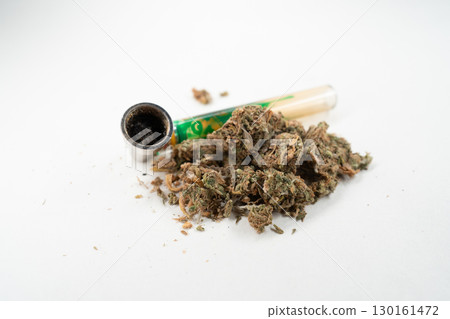 Cannabis Buds and a Bong Resting on a Clean Cannabis Buds and a Bong Resting on a Clean 130161472