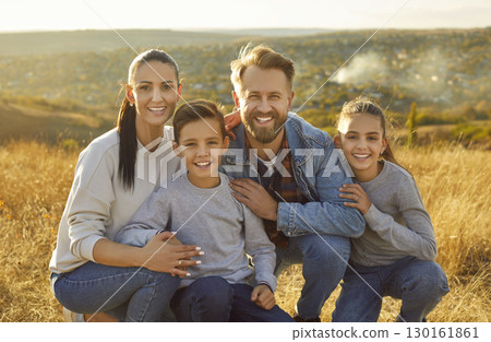 Happy family together portrait, beautiful nature background 130161861