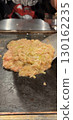 Monjayaki grilled on a hot plate 130162235