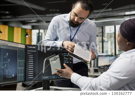 Team of RD departments experts in office work together on solar device for sustainable energy projects. Clean technology company colleagues design solar gadget prototype to reduce environmental impact Team of RD departments experts in office work together on solar device for sustainable energy projects. Clean technology company colleagues design solar gadget prototype to reduce environmental impact 130162777