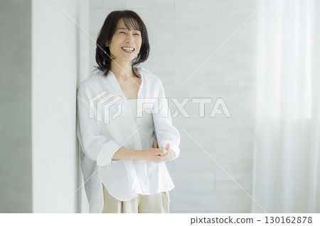 A woman with a white shirt A woman with a white shirt 130162878