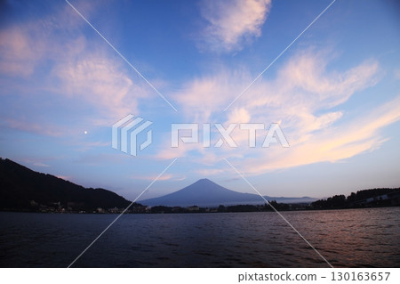 Mount Fuji illuminated by the setting sun as seen from Lake Kawaguchi 130163657