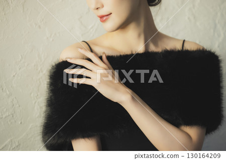 Woman wearing fur 130164209