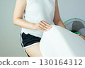 Hands woman making bed at home in the morning,Make a bed 130164312