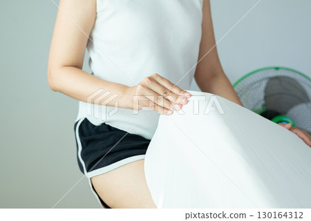 Hands woman making bed at home in the morning,Make a bed 130164312