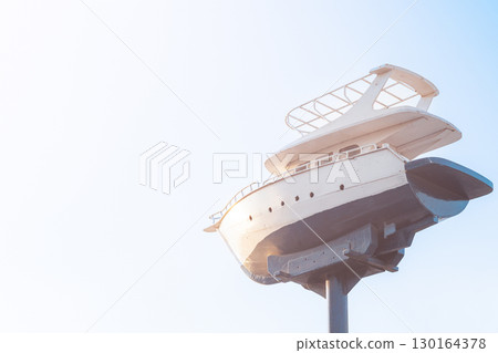Model yacht sculpture against clear sky 130164378