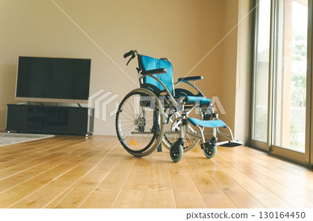 Wheelchair in the living room 130164450
