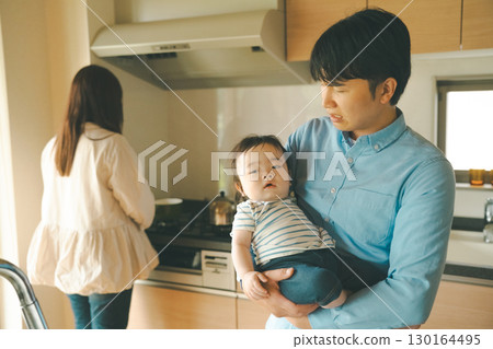 a cuddle, family, kitchen 130164495