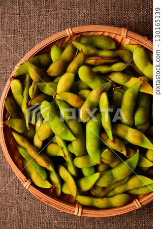 Green soybeans in a bamboo basket Green soybeans in a bamboo basket 130165139