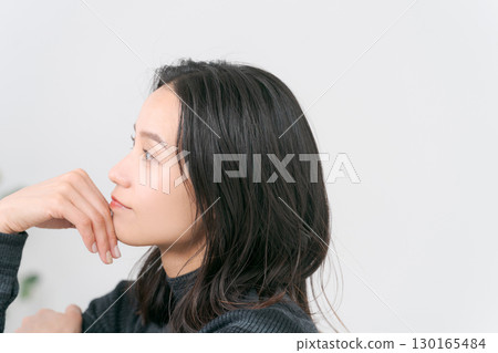 Portrait of a woman wearing knitwear 130165484