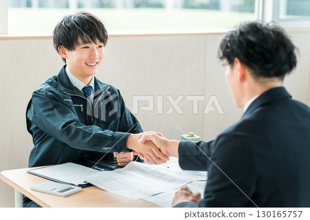Young Asian businessman in work clothes negotiating a building, tenant contract, business deal Young Asian businessman in work clothes negotiating a building, tenant contract, business deal 130165757
