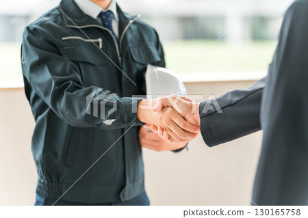 Male businessman in work clothes shaking hands, worker 130165758