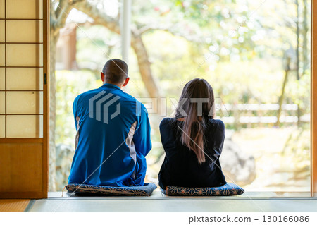 A man and woman talking on the veranda of a Japanese-style room in a rural house A man and woman talking on the veranda of a Japanese-style room in a rural house 130166086