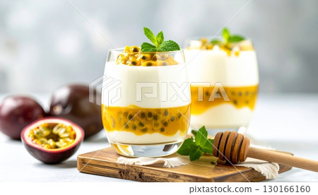Yogurt with Passion Fruit and Fresh Mango Topping in a Glass 130166160