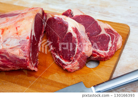 Closeup of beef tenderloin on cutting board 130166393