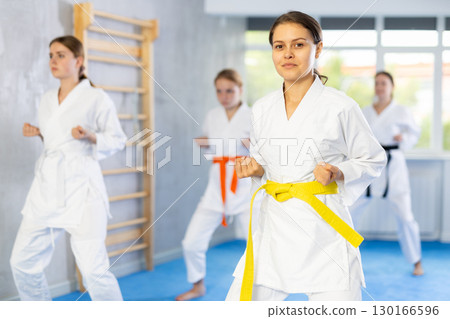 Teenage girls in kimono doing kata training 130166596