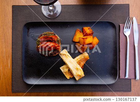 cuisine american burger with fried potato served on plate on table cuisine american burger with fried potato served on plate on table 130167137