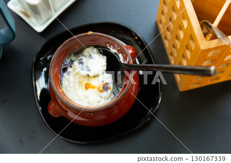 Dumplings, baked with cream 130167339