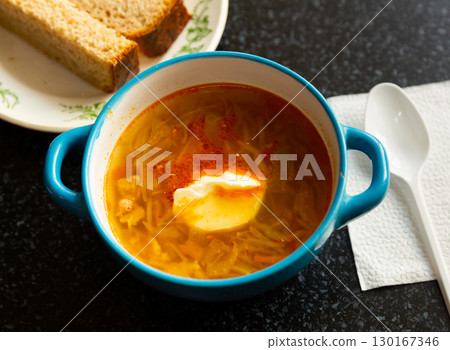 Traditional dish of Russian cuisine is cabbage soup 130167346