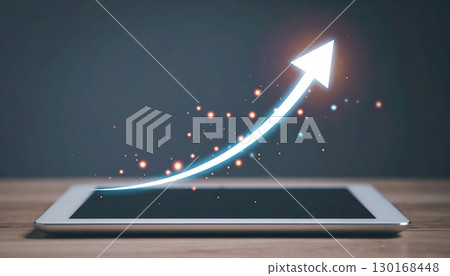 Modern digital tablet with glowing upward arrow symbolizing growth progress and technology advancement in a sleek minimalist setting 130168448