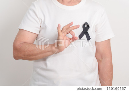 Elderly with Black ribbon for May Melanoma and skin cancer Awareness month, October Vaccine injury awareness month, Mourning Remembrance, March Sleep awareness week, Gang Prevention and Anti Violence 130169567