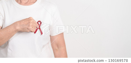 Elderly with Burgundy Ribbon for March Multiple Myeloma Cancer Awareness month, September Sickle Cell Anemia, Headache and Migraine week, April world Meningitis day, October Hospice Palliative care Elderly with Burgundy Ribbon for March Multiple Myeloma Cancer Awareness month, September Sickle Cell Anemia, Headache and Migraine week, April world Meningitis day, October Hospice Palliative care 130169578